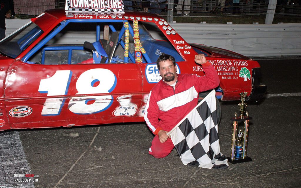 Black and white abstract pattern with concentric circles and wave shapes.