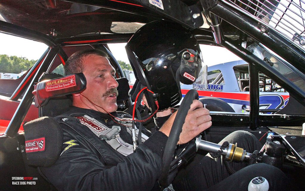 Black and white abstract pattern with concentric circles and wave shapes.