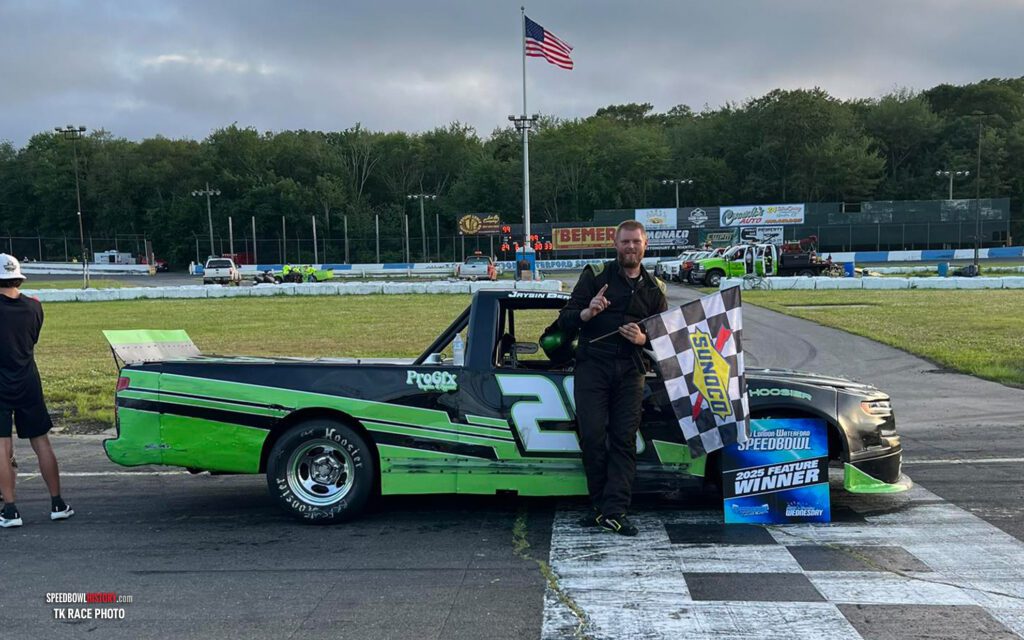 Black and white abstract pattern with concentric circles and wave shapes.