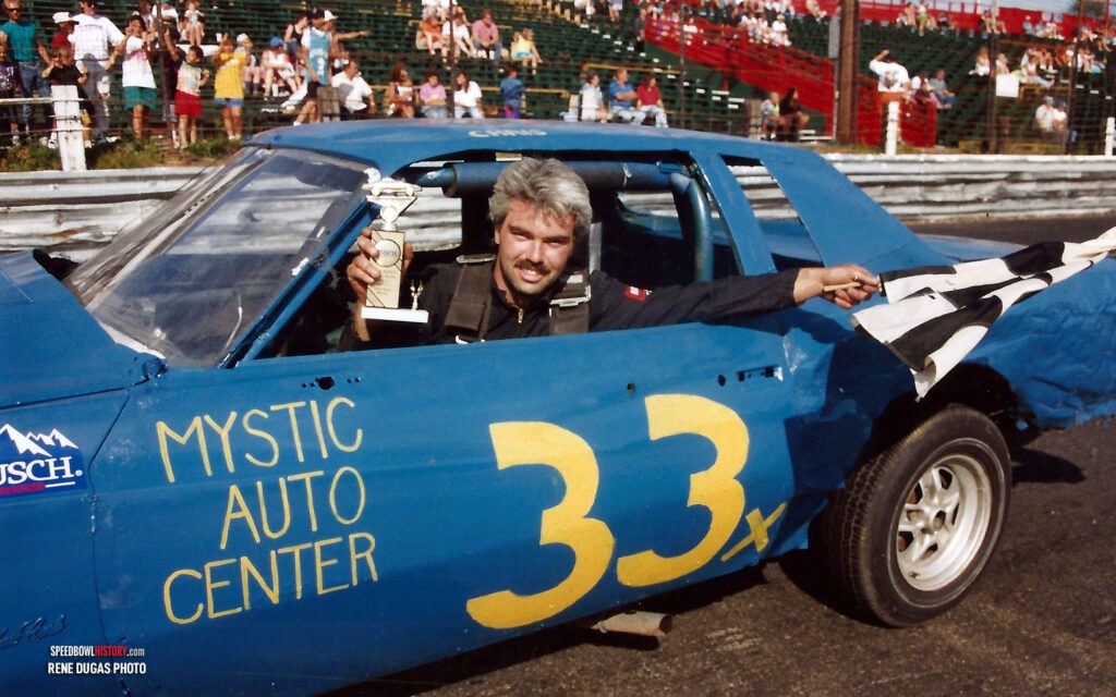 Black and white abstract pattern with concentric circles and wave shapes.