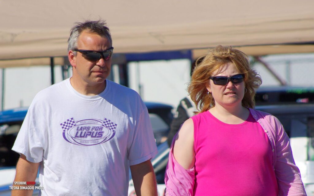 Black and white abstract pattern with concentric circles and wave shapes.