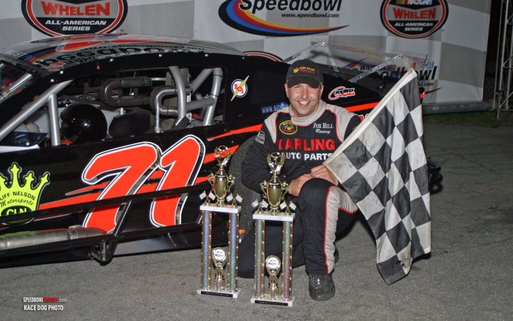 Black and white abstract pattern with concentric circles and wave shapes.