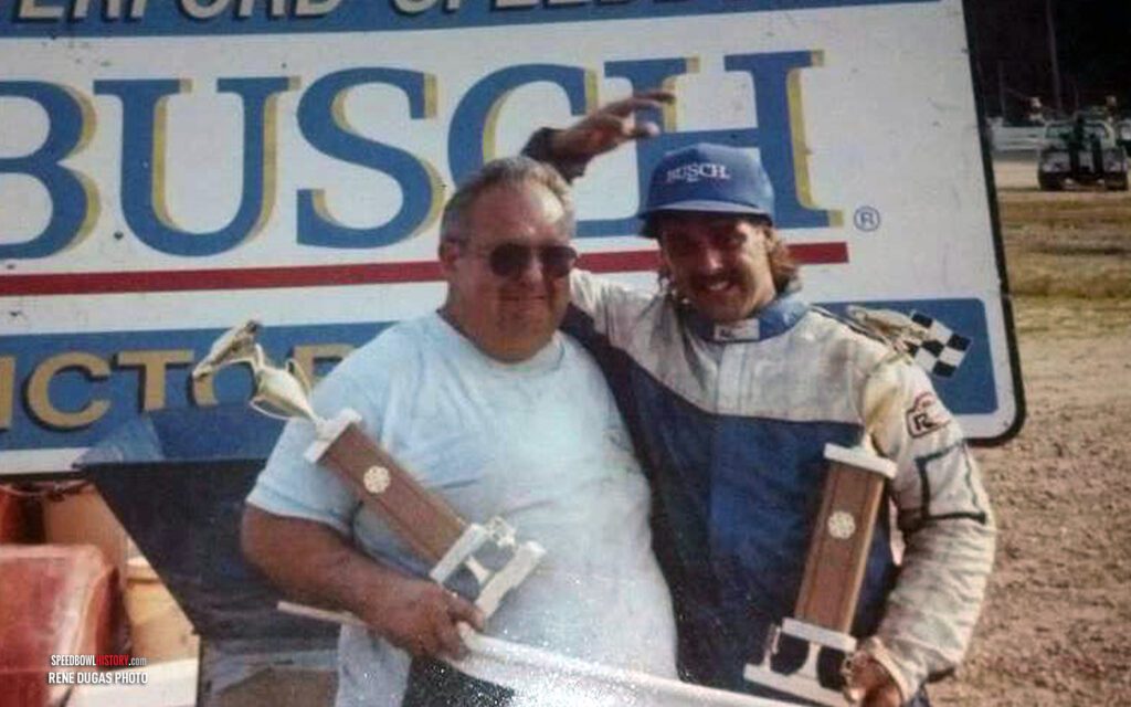 Black and white abstract pattern with concentric circles and wave shapes.