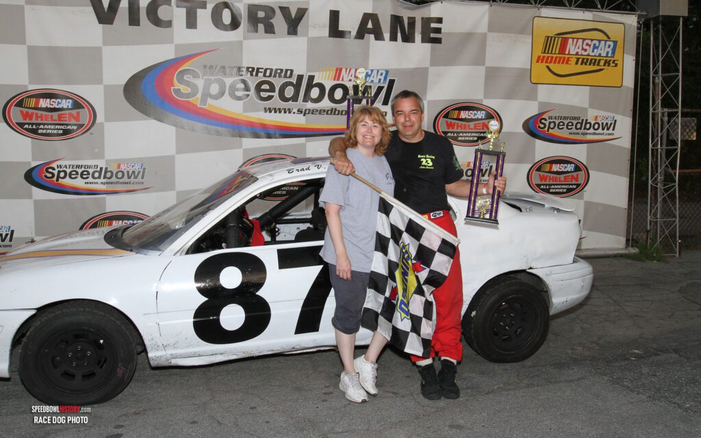 Black and white abstract pattern with concentric circles and wave shapes.