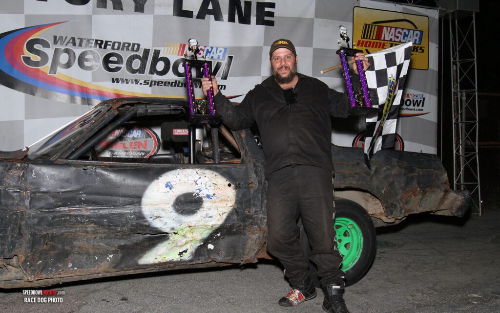 Black and white abstract pattern with concentric circles and wave shapes.