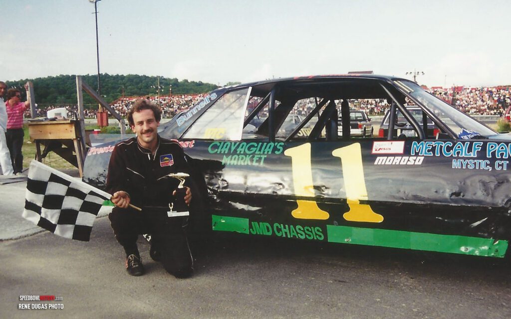 Black and white abstract pattern with concentric circles and wave shapes.