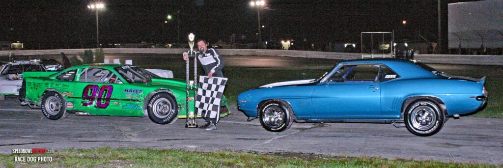 Black and white abstract pattern with concentric circles and wave shapes.