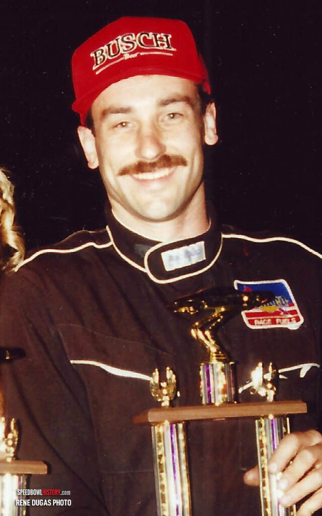 Black and white abstract pattern with concentric circles and wave shapes.