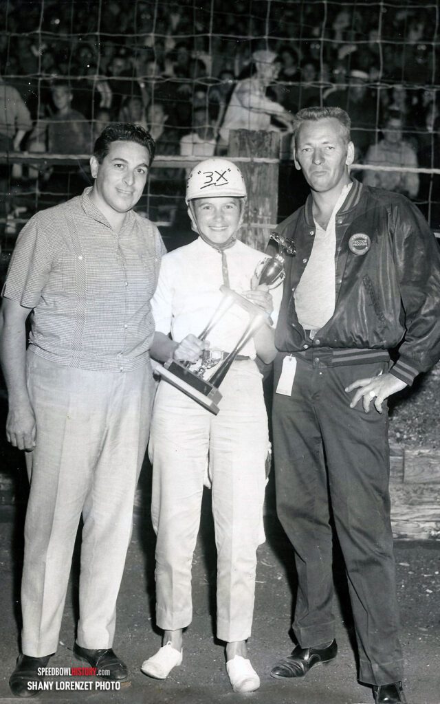 Black and white abstract pattern with concentric circles and wave shapes.