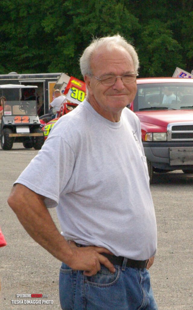 Black and white abstract pattern with concentric circles and wave shapes.