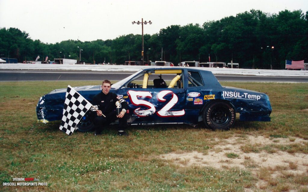 Black and white abstract pattern with concentric circles and wave shapes.