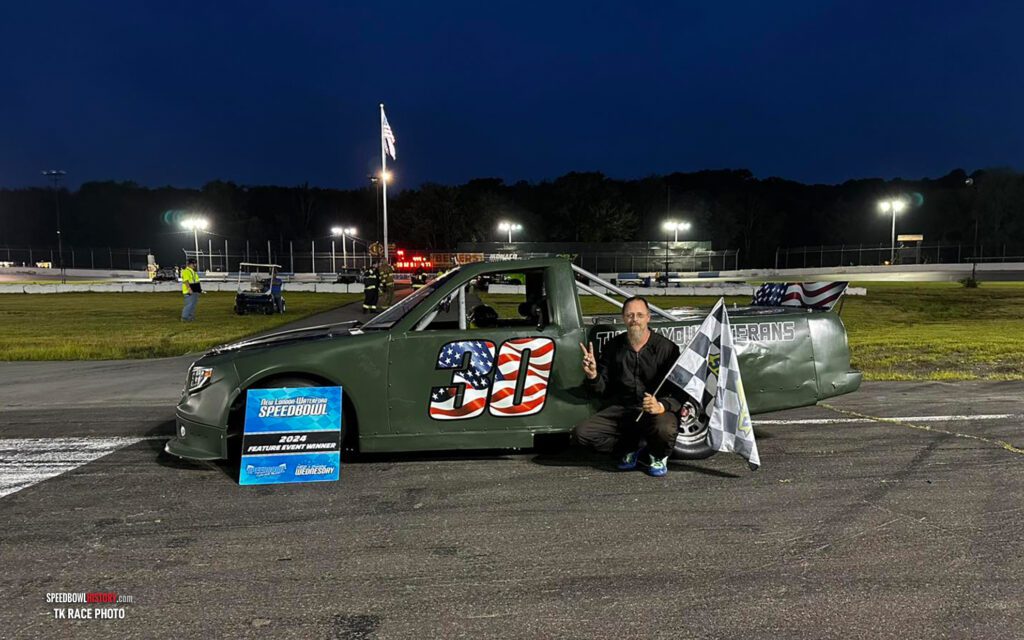 Black and white abstract pattern with concentric circles and wave shapes.