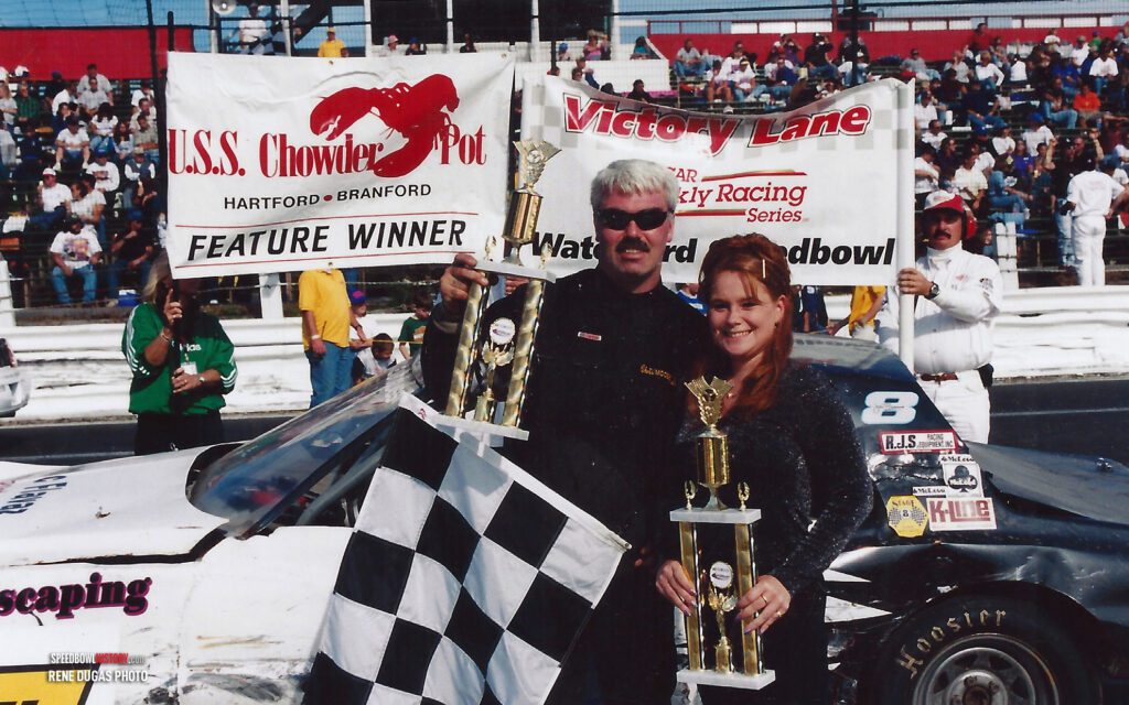 Black and white abstract pattern with concentric circles and wave shapes.