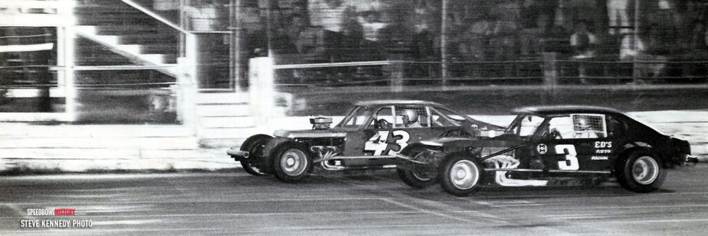 Black and white abstract pattern with concentric circles and wave shapes.