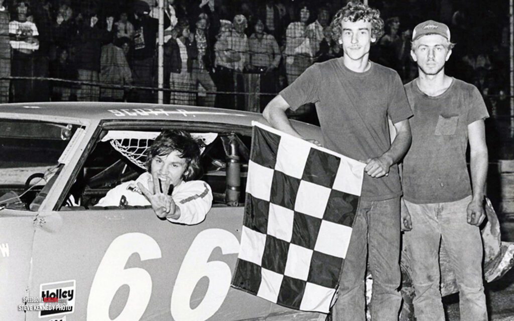 Black and white abstract pattern with concentric circles and wave shapes.