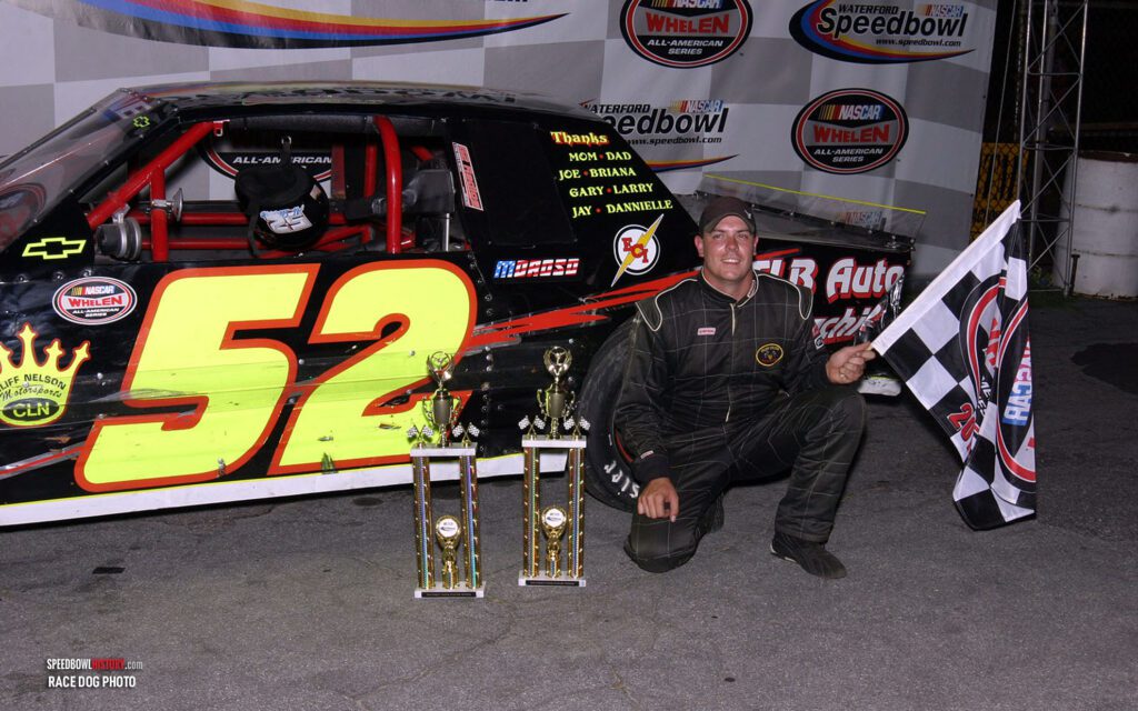 Black and white abstract pattern with concentric circles and wave shapes.