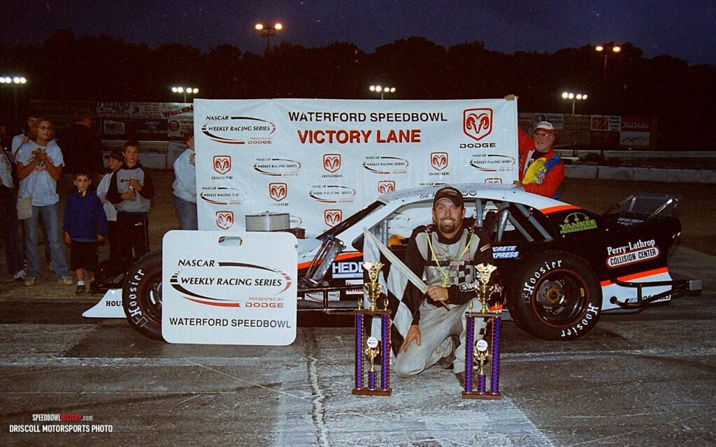 Black and white abstract pattern with concentric circles and wave shapes.