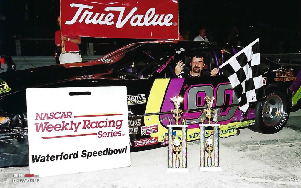 Black and white abstract pattern with concentric circles and wave shapes.