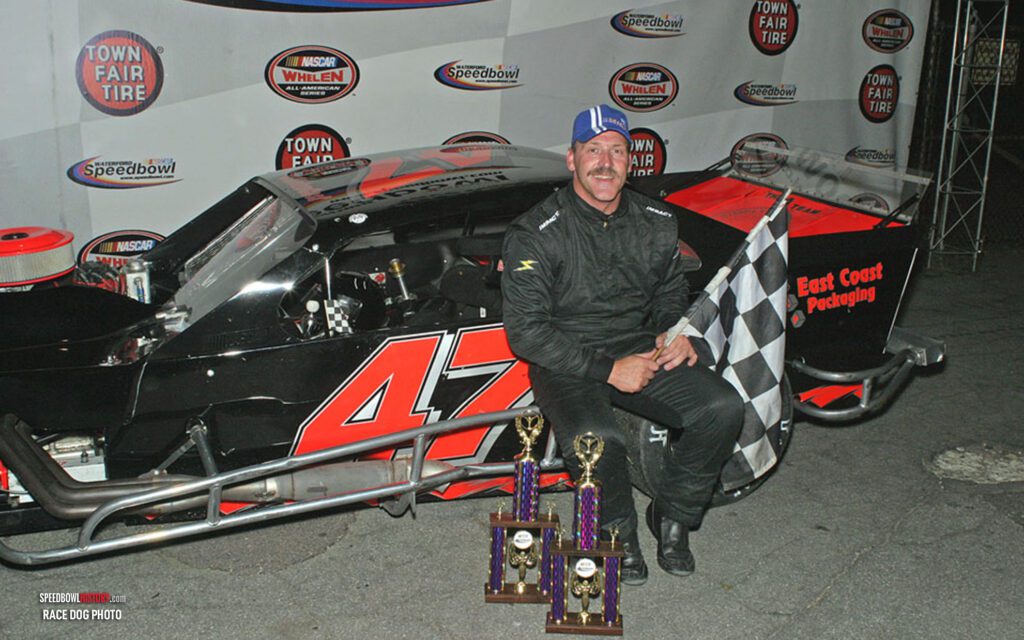 Black and white abstract pattern with concentric circles and wave shapes.