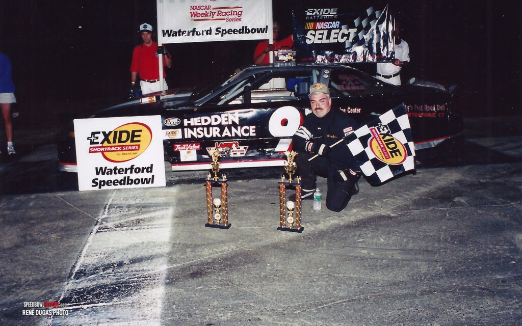 Black and white abstract pattern with concentric circles and wave shapes.