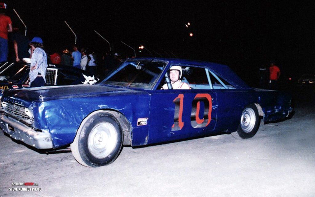 Black and white abstract pattern with concentric circles and wave shapes.