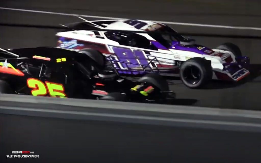 Black and white abstract pattern with concentric circles and wave shapes.