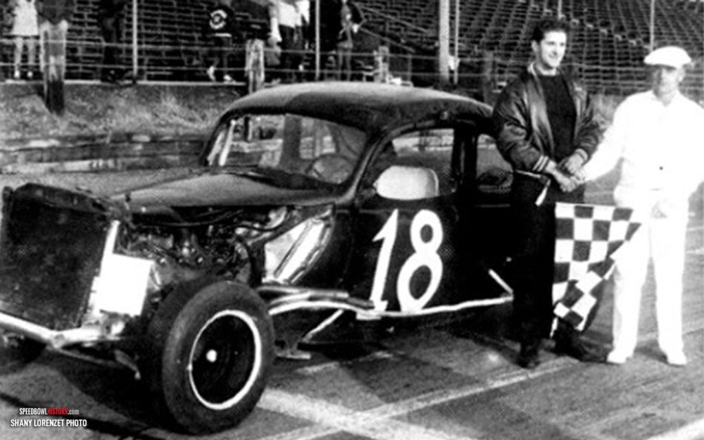 Black and white abstract pattern with concentric circles and wave shapes.