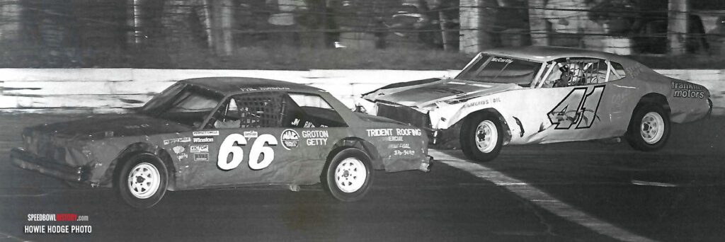 Black and white abstract pattern with concentric circles and wave shapes.