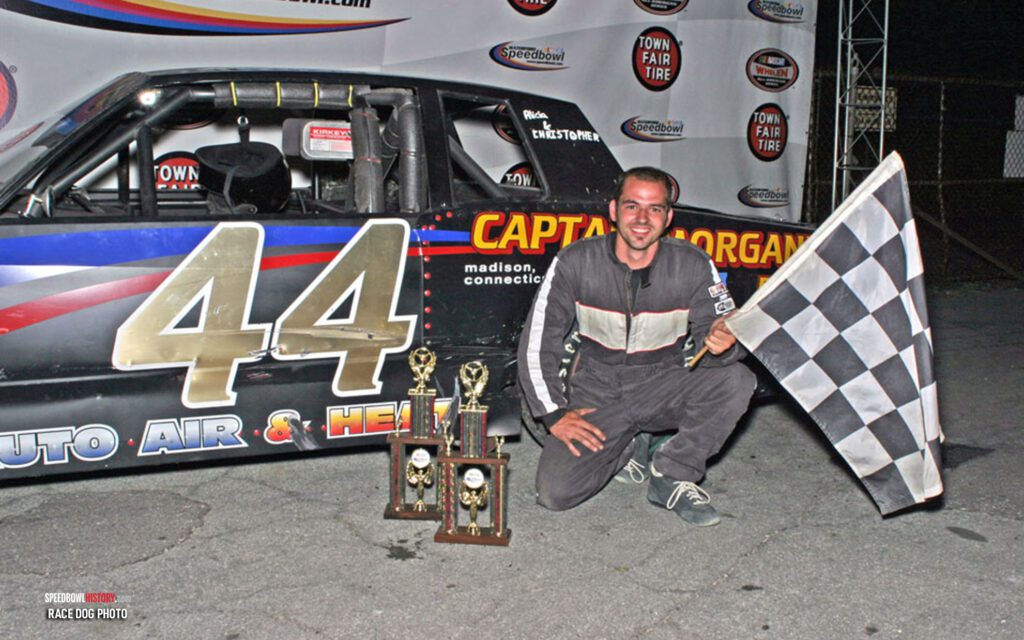 Black and white abstract pattern with concentric circles and wave shapes.