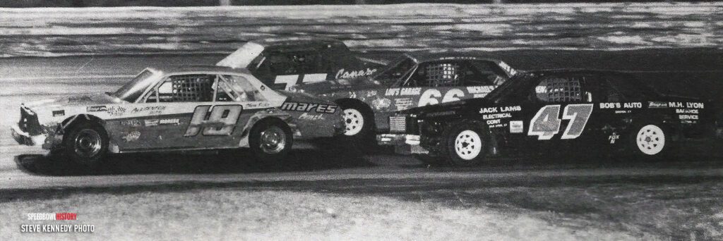 Black and white abstract pattern with concentric circles and wave shapes.