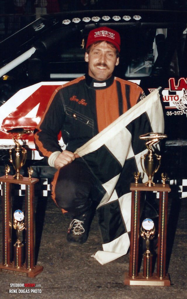 Black and white abstract pattern with concentric circles and wave shapes.