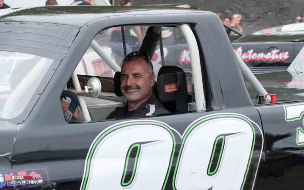 Black and white abstract pattern with concentric circles and wave shapes.