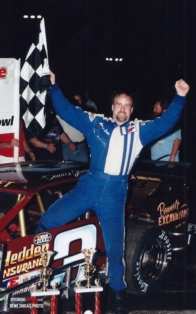 Black and white abstract pattern with concentric circles and wave shapes.