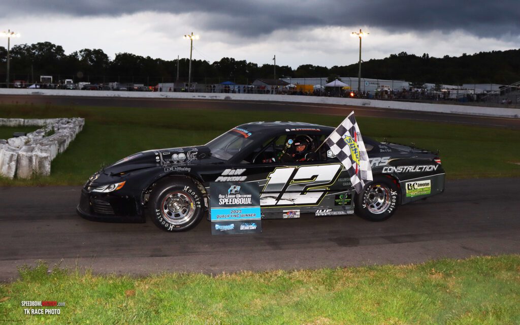 Black and white abstract pattern with concentric circles and wave shapes.