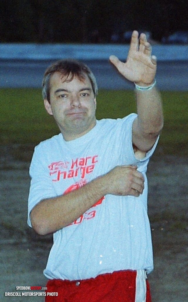 Black and white abstract pattern with concentric circles and wave shapes.