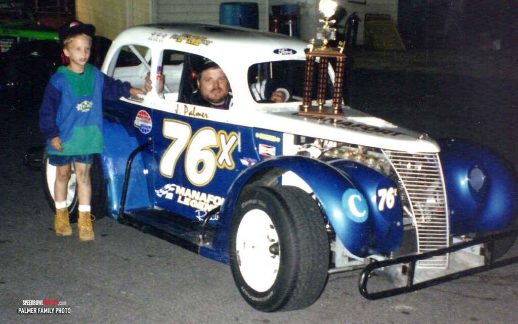 Black and white abstract pattern with concentric circles and wave shapes.