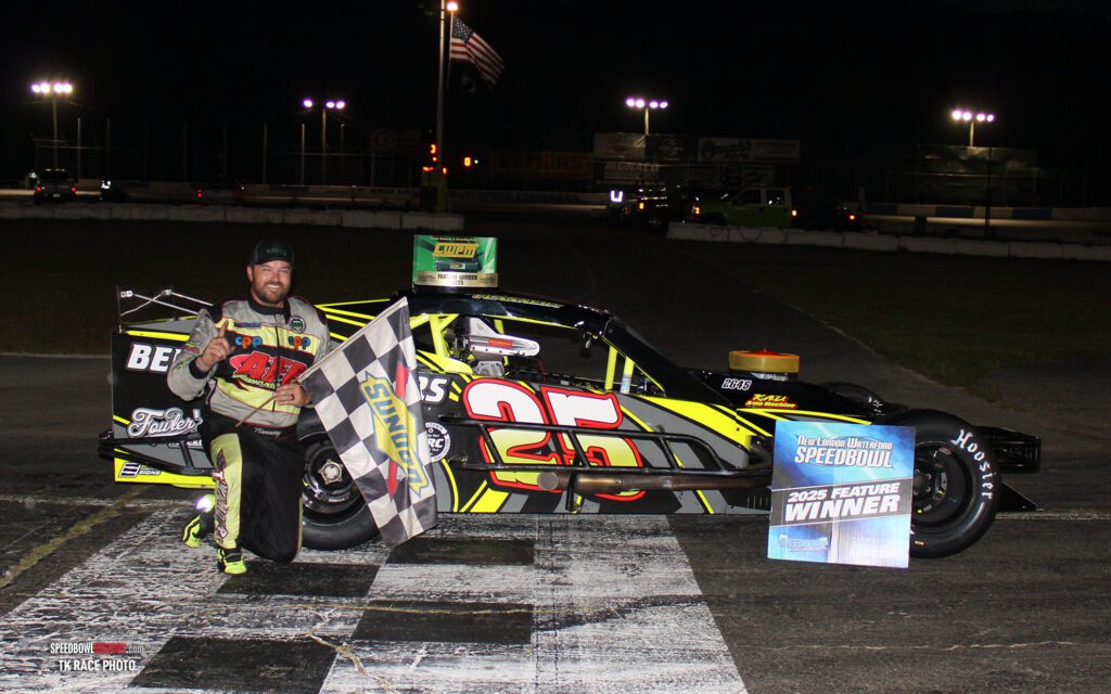 Black and white abstract pattern with concentric circles and wave shapes.