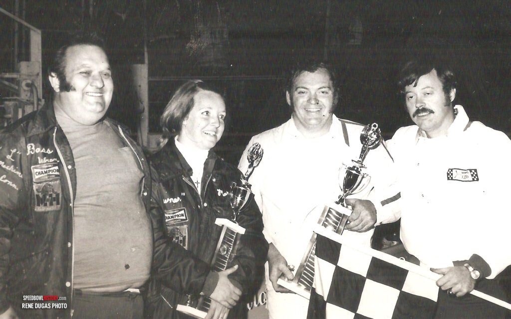 Black and white abstract pattern with concentric circles and wave shapes.