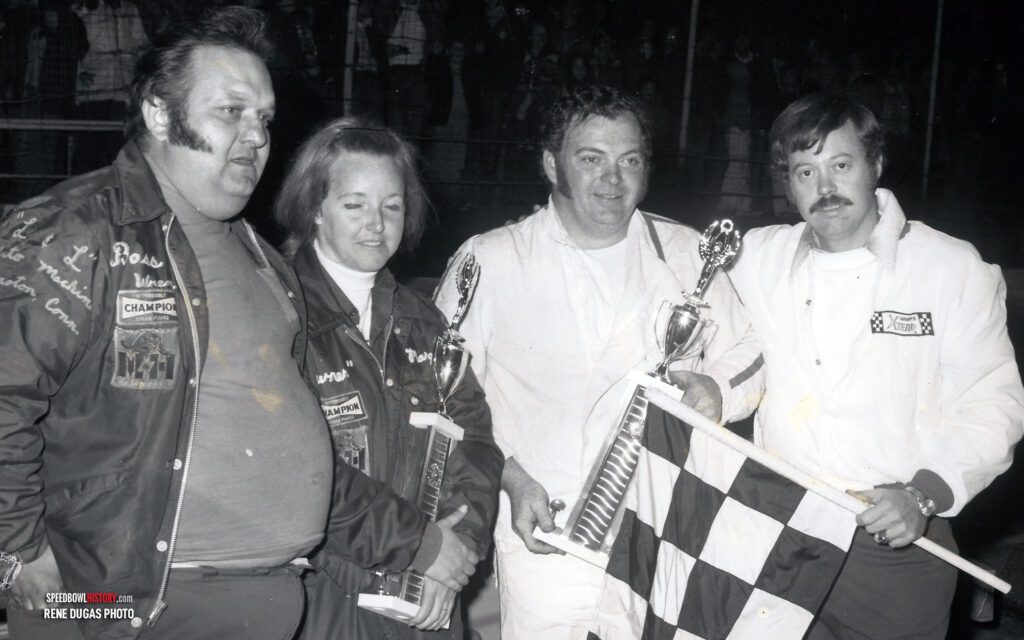 Black and white abstract pattern with concentric circles and wave shapes.