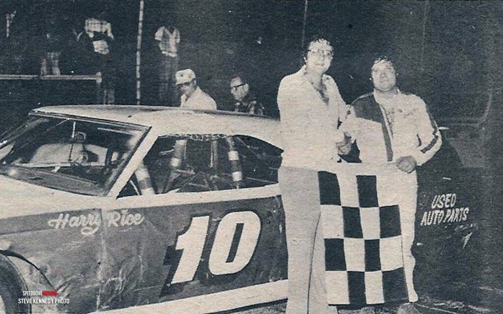 Black and white abstract pattern with concentric circles and wave shapes.