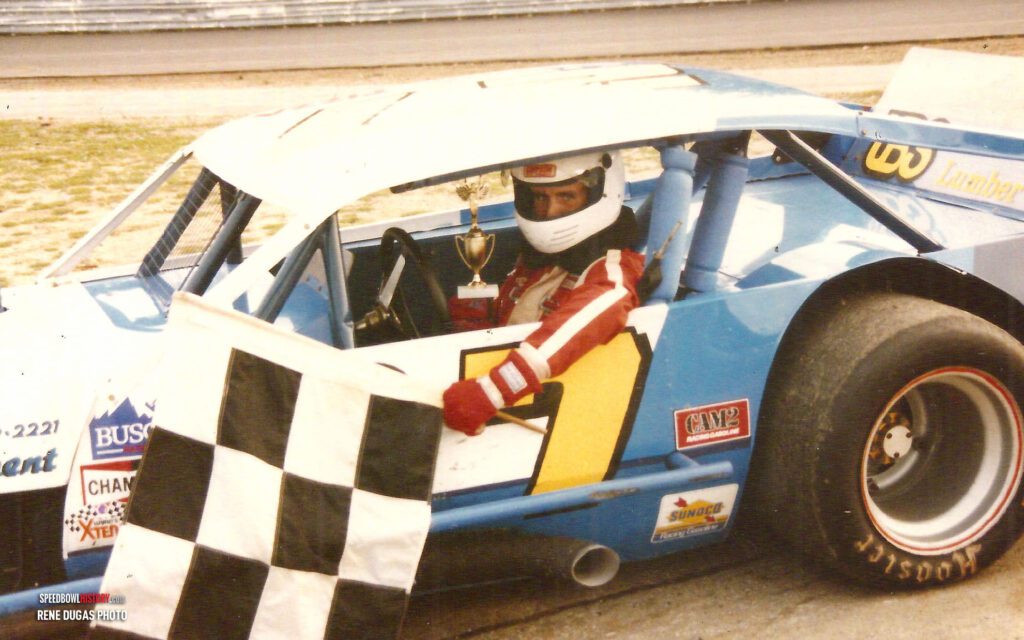 Black and white abstract pattern with concentric circles and wave shapes.