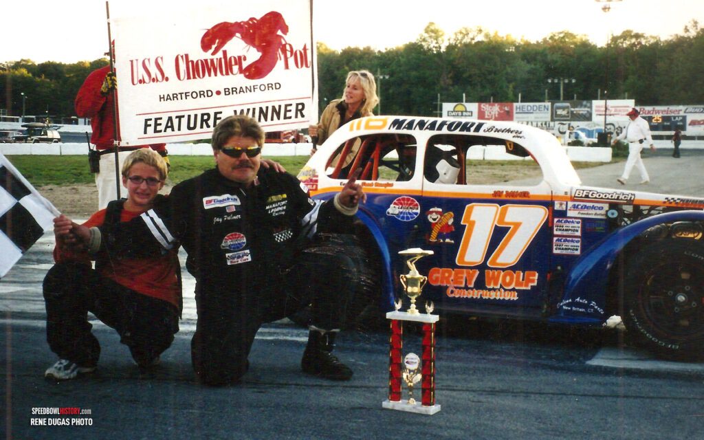 Black and white abstract pattern with concentric circles and wave shapes.