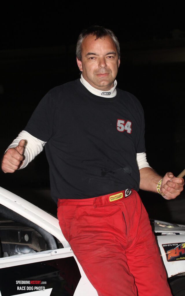 Black and white abstract pattern with concentric circles and wave shapes.