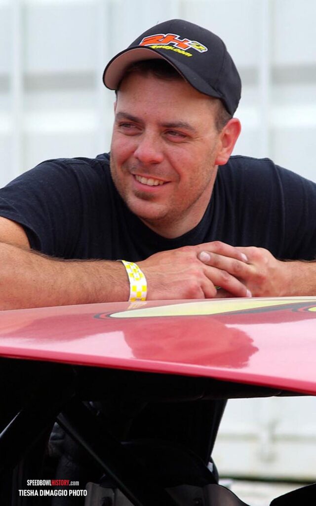 Black and white abstract pattern with concentric circles and wave shapes.