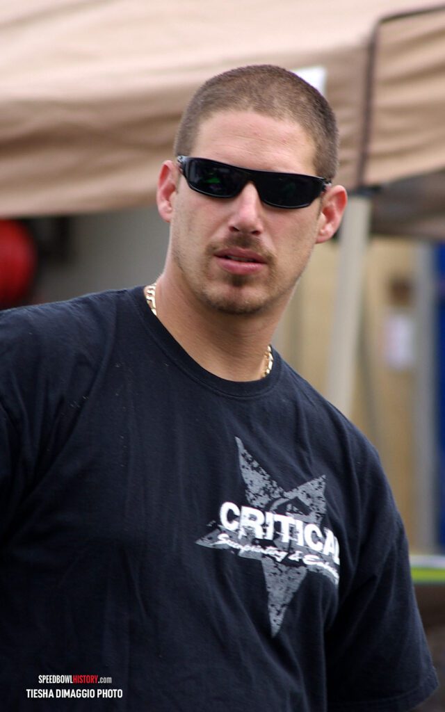 Black and white abstract pattern with concentric circles and wave shapes.