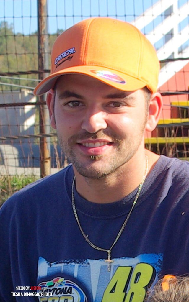 Black and white abstract pattern with concentric circles and wave shapes.