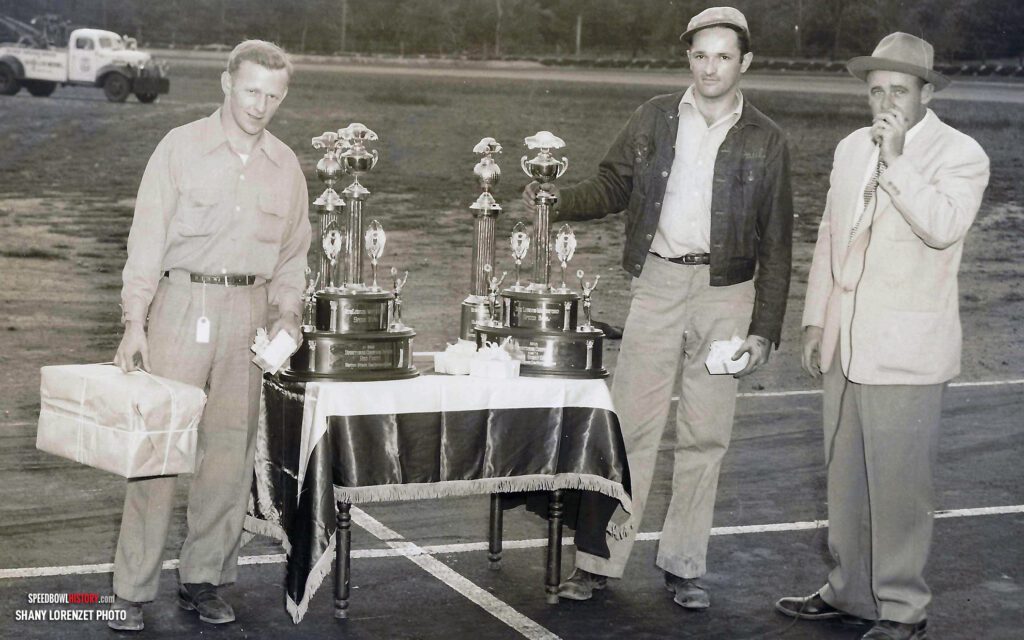 Black and white abstract pattern with concentric circles and wave shapes.