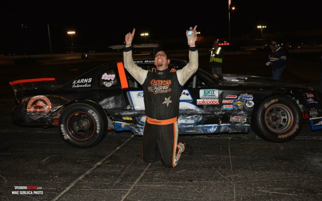 Black and white abstract pattern with concentric circles and wave shapes.