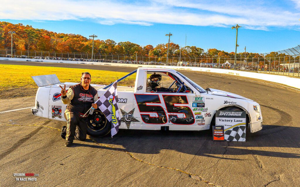 Black and white abstract pattern with concentric circles and wave shapes.