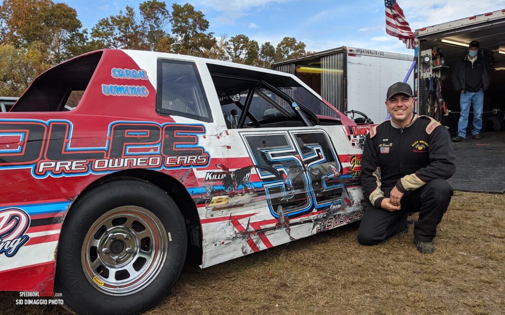 Black and white abstract pattern with concentric circles and wave shapes.